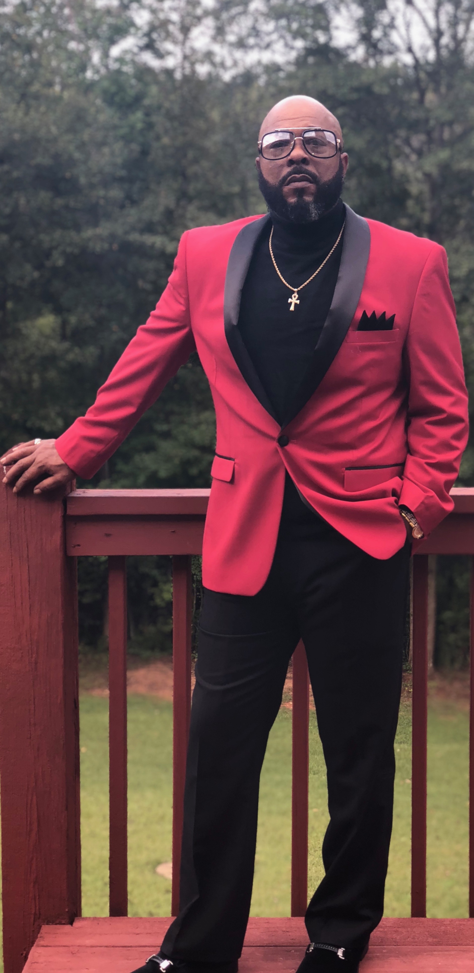 OG Sweetz in a red jacket outdoors